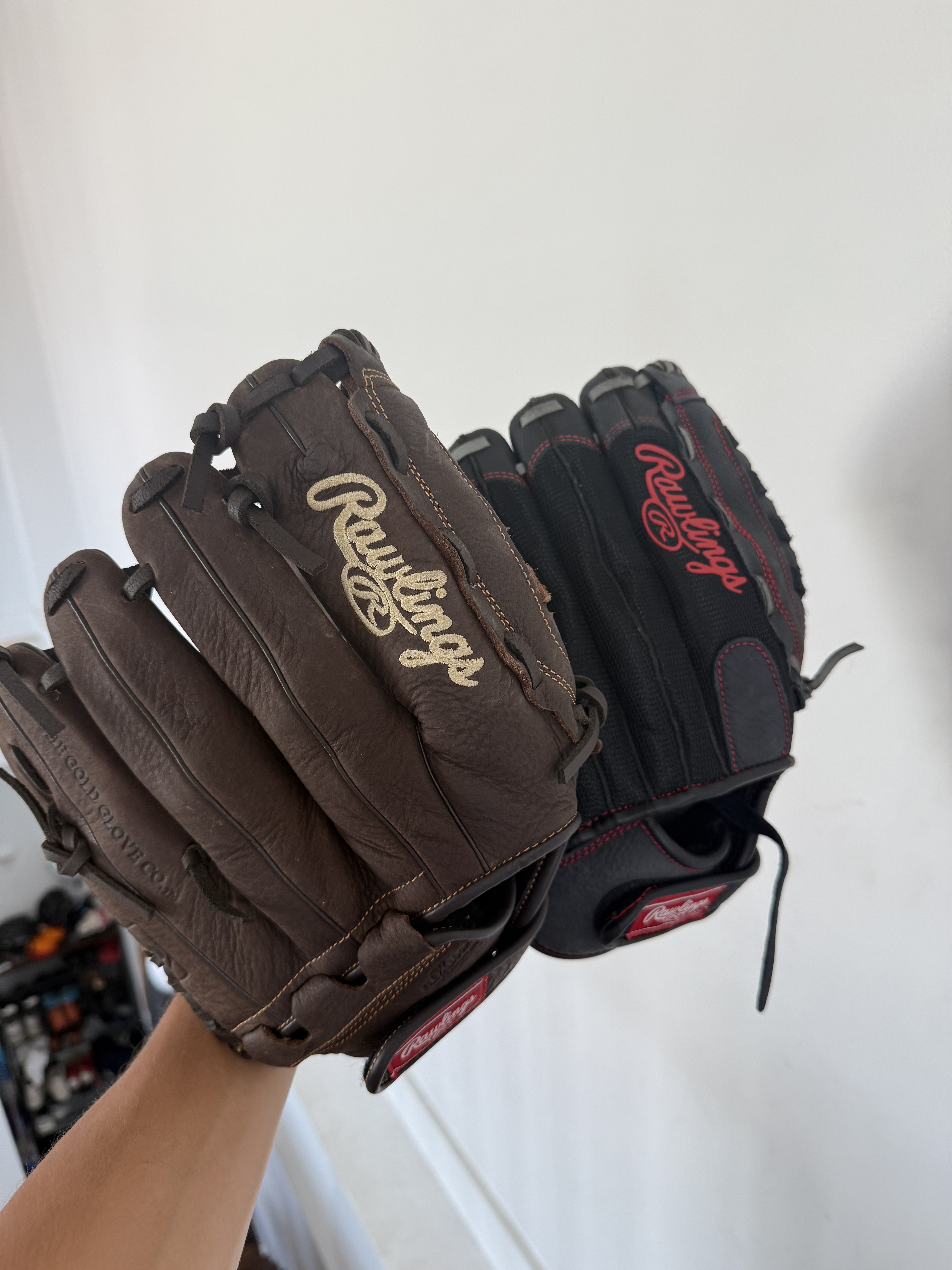 Pair of adult baseball gloves with ball